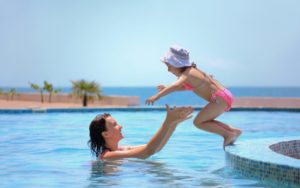 child-jumping-in-pool-1080x675