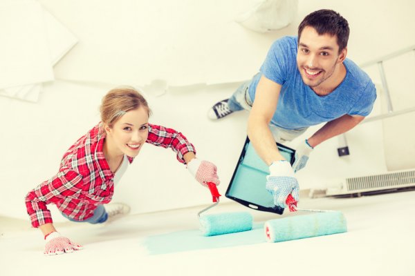 depositphotos_63082847-stock-photo-smiling-couple-painting-wall-at