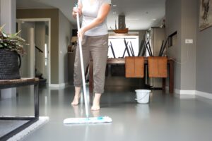 housekeeper-cleaning-the-floor-in-the-living-room-2023-11-27-05-32-44-utc