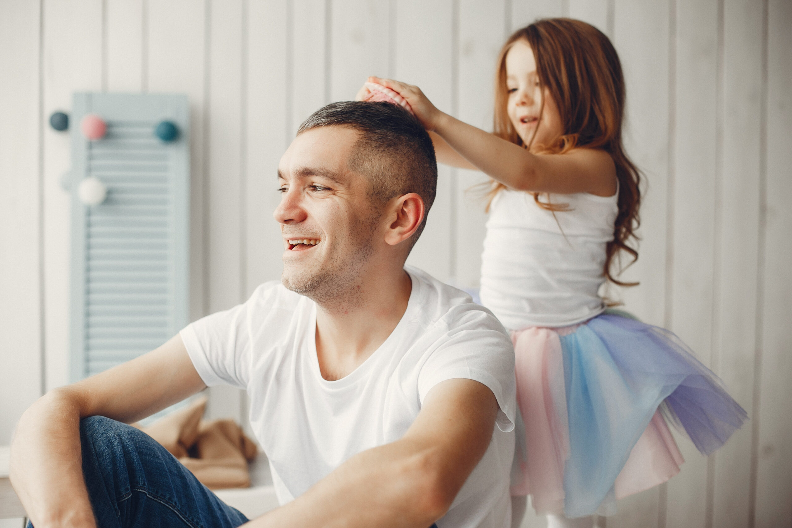 Father playing with a little daughter